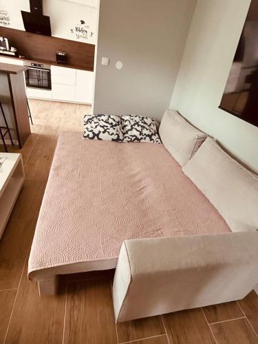 a living room with a large couch in a room at AS Apartment Free Parking and Peaceful Nature near Ljubljana in Škofljica