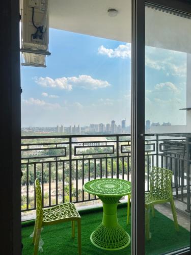 a view from a balcony with a table and chairs at Luxury stays in Greater Noida