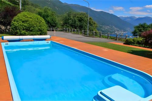 a swimming pool on the roof of a house at Eden Rock in Cannobio
