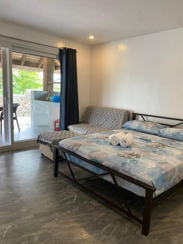 a bedroom with a bed and a couch in it at Peaceful Turtle Camp in San Francisco