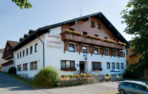 a building with a sign on the side of it at Landhotel-Gasthof-Schreiner in Hohenau