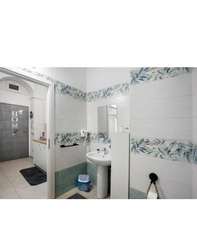 a bathroom with a sink and a shower at Casetta FRM home in Naples