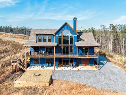 an aerial view of a blue house with a deck at Blue Salamander Lodge in Talking Rock