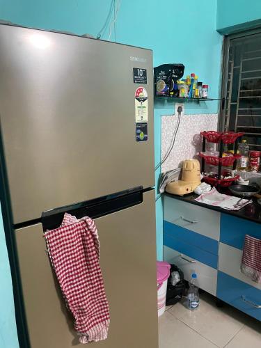 a refrigerator with a towel on it in a kitchen at Abode of Peace in Esperance