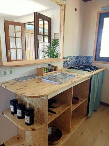 a kitchen with a wooden counter top in a room at A l'Est d'Eden in Hastière-Lavaux