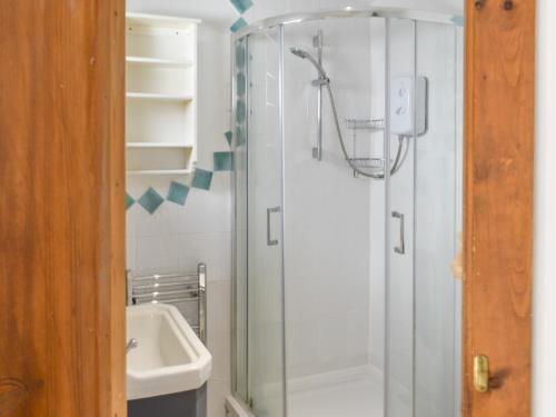 a bathroom with a shower and a sink at Hen Joppa in Newlyn