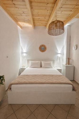 a bedroom with a large bed with a wooden ceiling at Sesi Luxury Suites Seaside & Private Pool in Marathon