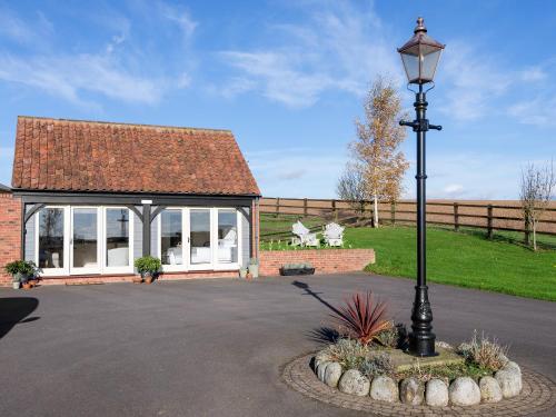 a street light in front of a building at Cow Pasture Cottage in Hallington