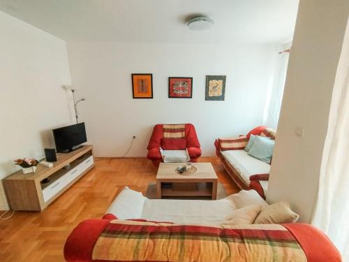 a living room with a couch and a table at Studio Centar in Trebinje