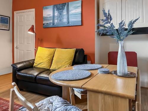 a living room with a couch and a table at The Salthouse in Sunderland