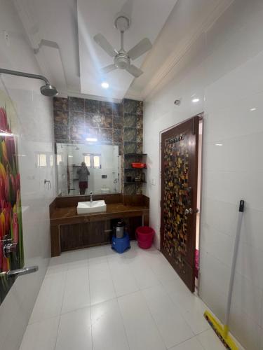 a bathroom with a sink and a mirror at Golden Villas in Rewāri