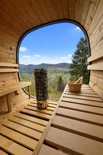 an inside view of a sauna with a large window at la brume des cimes in Bussang