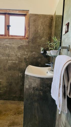a bathroom with a sink and a window at FA Resort in Panama