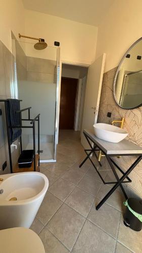 a bathroom with a sink and a mirror at Fabio Filzi 32 sub 7 in Lainate