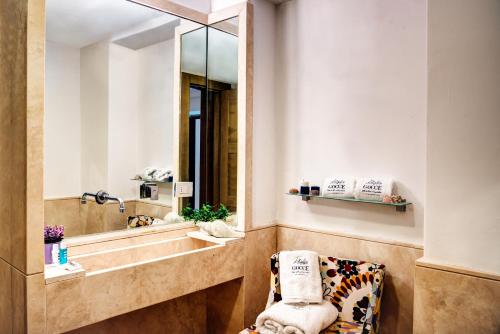 a bathroom with a sink and a mirror at GOCCE VILLAS - Villa Bouganvillea Superb Capri Villa with Views in Capri