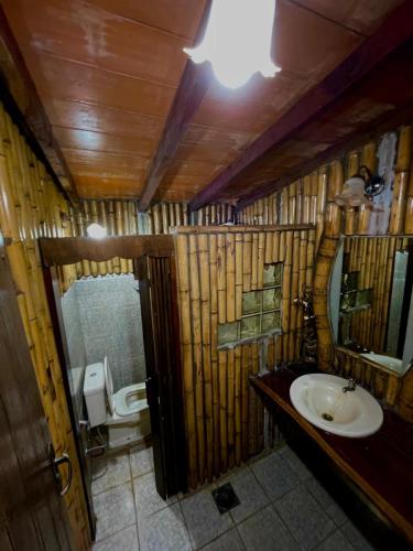 a bathroom with a sink and a toilet at Casa de Campo Las Marías in Areguá