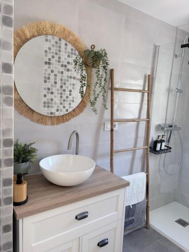 a bathroom with a sink and a mirror at La Luz in Zuheros