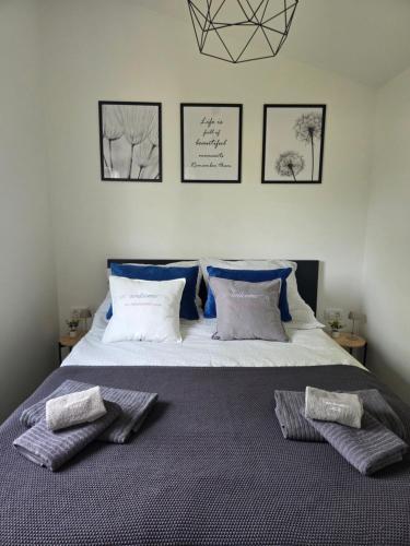 a bedroom with a bed with two pillows on it at Studio Apartment Ceca*** in Fažana