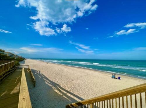 a view of a beach with people on it at Ocean 21 - Waves & Wonders in Indian Harbour Beach