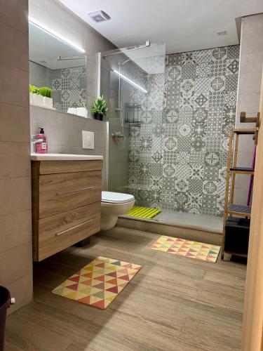 a bathroom with a toilet sink and a shower at Studio pas cher au parc in Mohammedia