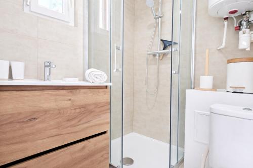 a bathroom with a shower and a toilet and a sink at 5 Mins to Train Station - Paris & DisneyLand - Cosy des Reves Villiers in Villiers-sur-Marne
