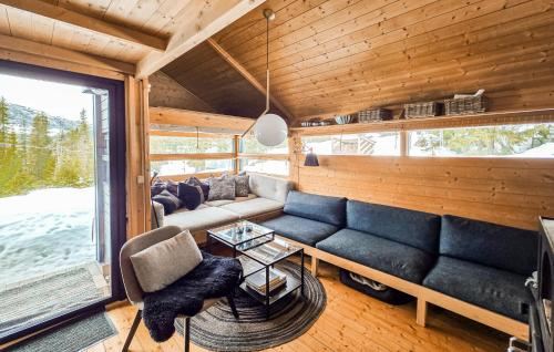 a living room with a couch and a table at Amazing Home In Eggedal With Wifi in Eggedal