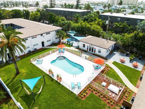 an aerial view of a swimming pool in a yard at Ocean 16 - Pier View in Indian Harbour Beach