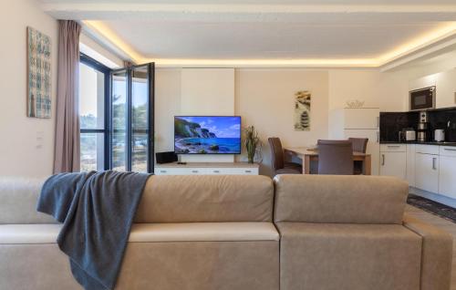 a living room with a couch and a dining room at Prince in Binz