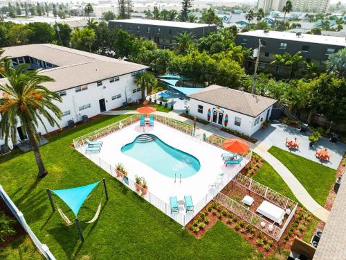 an aerial view of a swimming pool in a yard at Ocean 6 - Surfside in Indian Harbour Beach