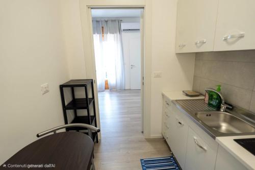 a kitchen with a sink and a counter at Prestige House 9 in Scalea