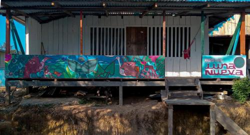 a building with a painting on the side of it at Cabaña Luna Nueva in Buenaventura