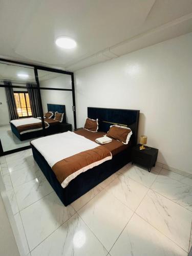 a bedroom with a large bed in a room at World Prestige Properties in Dakar
