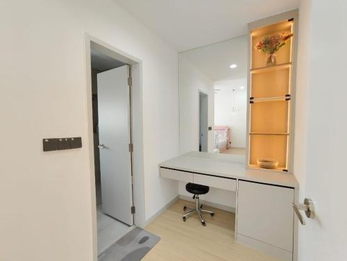 a dressing room with a desk and a mirror at Mallow Semi-D homestay in Rawang