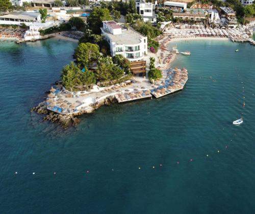 an aerial view of a resort in the water at Manta Hotel in Ksamil