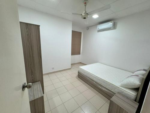 a room with a bed and a room with a door at Journy B Holiday Inn Ekala in Ekala