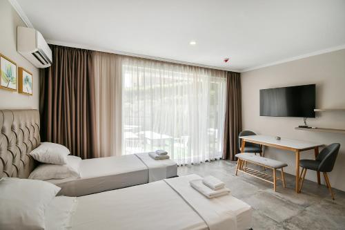 a hotel room with a bed and a desk at Sea lounge in Varna City