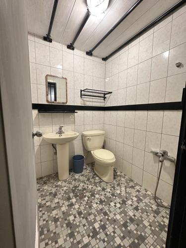 a bathroom with a toilet and a sink at 綠島-Hi Young 漾&漾居 in Green Island