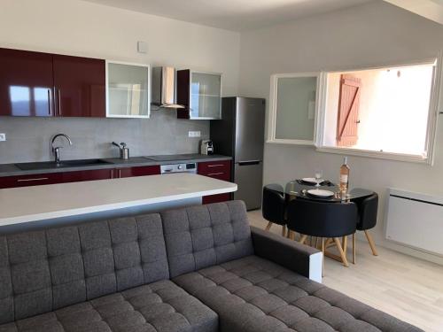 a kitchen with a couch and a table in a room at French Riviera near Nice Monaco, Apartments in Villa, Sea Montain View in Carros