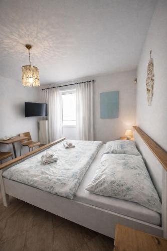 a bedroom with a large bed in a room at Penzion Cizku u Trebone in Třeboň