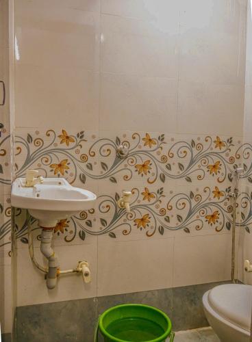 a bathroom with a sink and a toilet at Hotel GK Lodging & Boarding in Khāpri