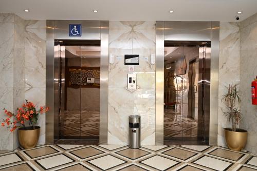 a lobby with two elevators in a building at Salsbil Almasi Hotel in Medina