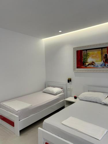 Postel nebo postele na pokoji v ubytování Maizon Rooms