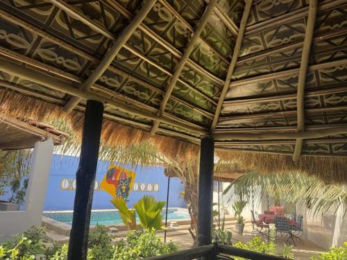 a view of the beach from the porch of a resort at Keur Medzo - Lac Rose in Niaga