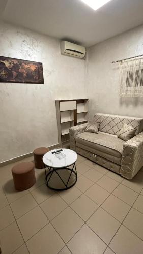a living room with a couch and a table at Panorama - 2 Lazarevac in Lazarevac
