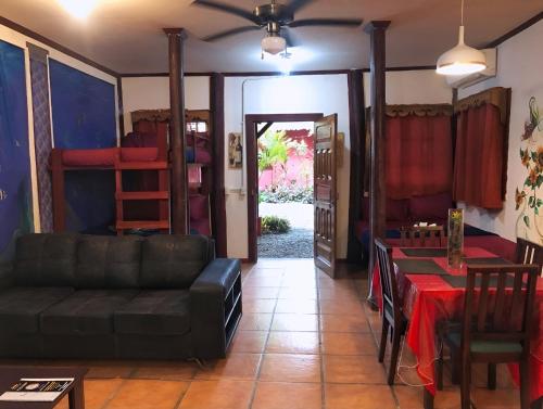 a living room with a couch and a table at Coral Lagoon in Puerto Viejo