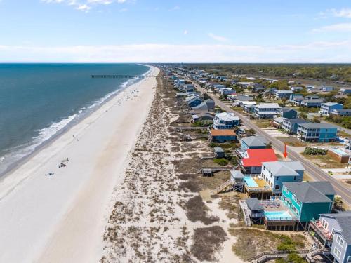 an aerial view of a beach with houses and the ocean at Oceanfront Luxury Private Steps to Beach New in Oak Island
