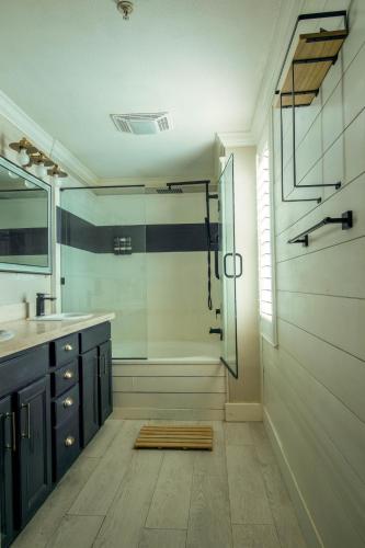 a bathroom with a shower and a sink at Midnight Modern in San Jose