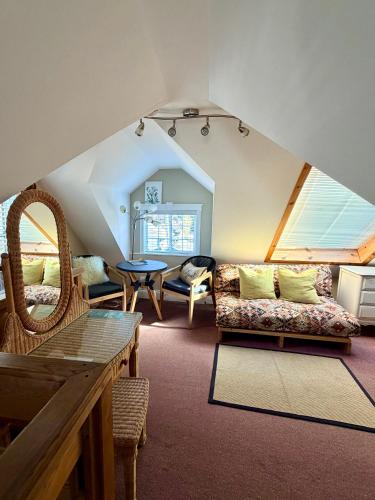 a living room with a couch and a table at Ocean Breeze Executive Bed and Breakfast in North Vancouver