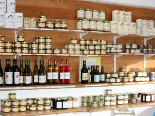 a shelf filled with lots of bottles of wine at Chalet accueillant - 4 pers. - API-1-52-2453 in Meyrueis