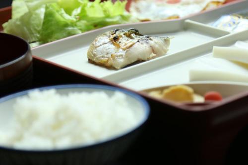 a tray of food with a piece of meat and salad at Fujimien in Fujikawaguchiko